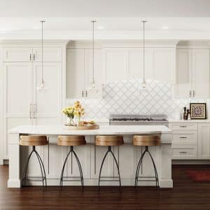 Image shows bright white woodland cabinetry in a modern, bright kitchen