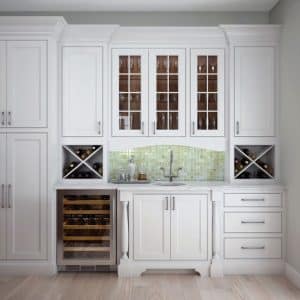 Image showing traditional or classic woodland cabinets painted white and storing wine