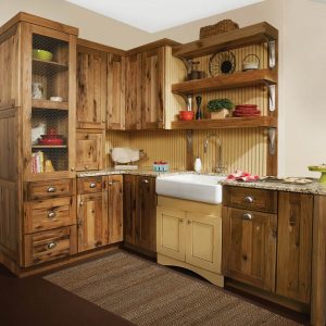 Image from Woodland Cabinetry Inspiration Gallery showing farmhouse kitchen with Rustic Farmstead cabinetry with Rustic Mission style wood doors and Reclaimed Patina finish