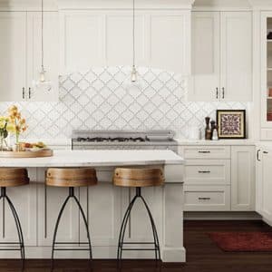 Image shows bright white custom woodland cabinetry in a modern, bright kitchen
