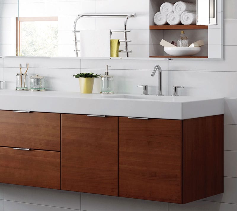 Image shows modern woodland cabinetry in a bathroom