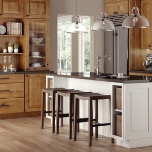 Image from Woodland Cabinetry Inspiration Gallery showing kitchen with Prairie style Rustic Bancroft Alder wood cabinetry doors with Sienna stain finish