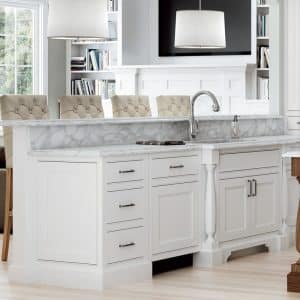 Image from Woodland Cabinetry Inspiration Gallery showing kitchen eat-in bar with Tara Plus Maple cabinetry painted Opaque White
